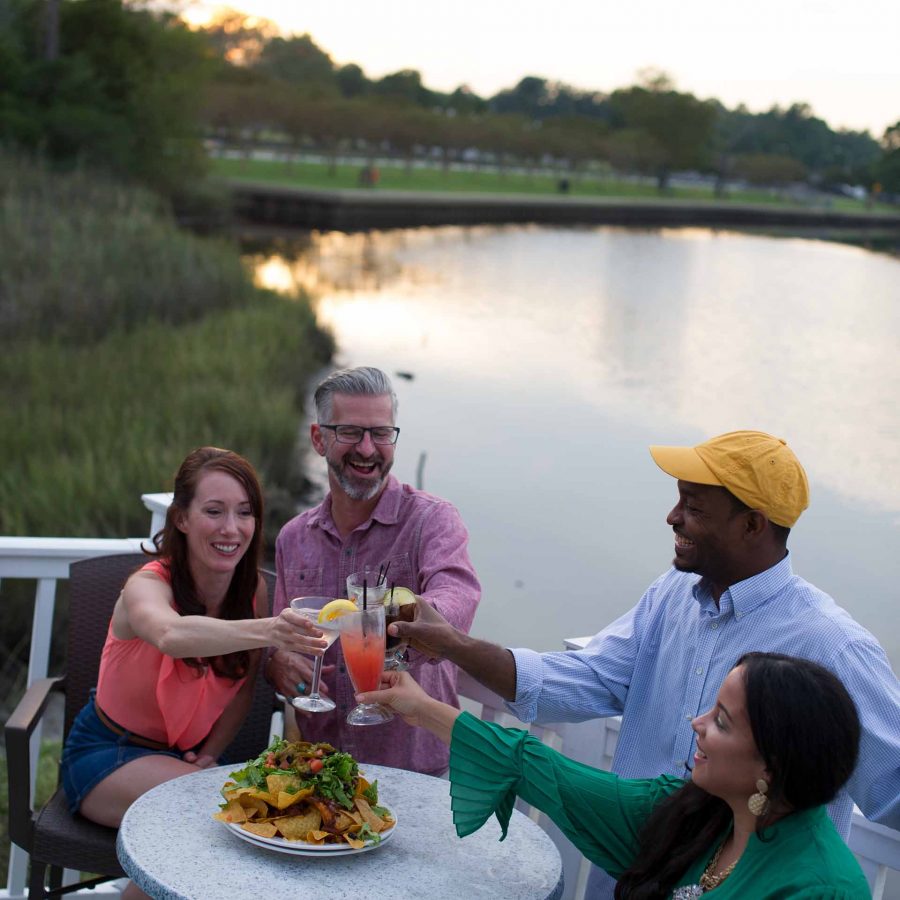 Friends eating at waterfront restaurant | Chesapeake Economic Development | Photography by Chesapeake Convention & Visitors Bureau