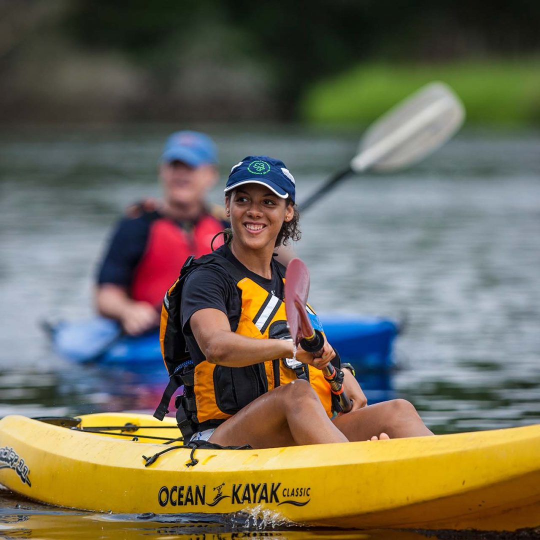 KayaXpedition Woman Sitting on Kayak | Chesapeake Economic Development